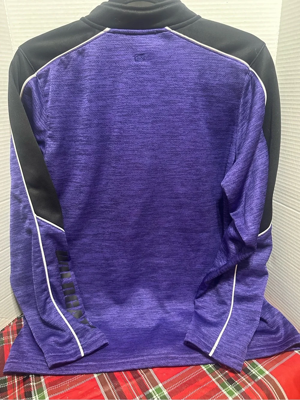 Two K-State Colosseum Youth XL quarter zips.